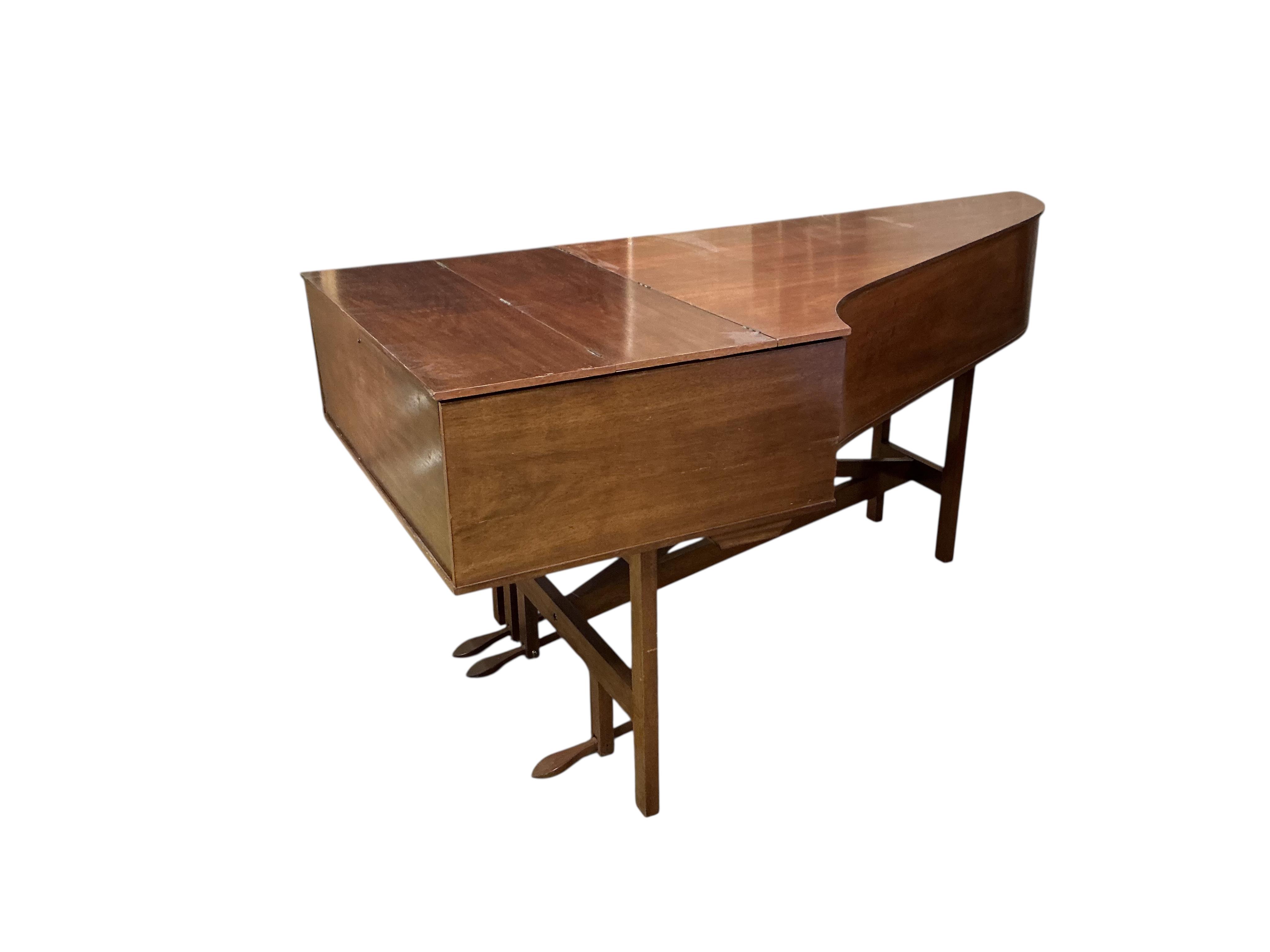 A 1960s two manual harpsichord by John Morley, 61 note compass on each manual with coupler, one stop and three pedals, in mahogany veneer, signed to the soundboard and above the manuals, serial number 1052, length 207cm